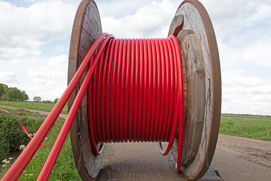 A large spool of fiber conduit